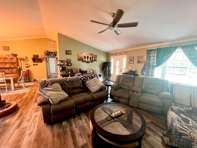 living room featuring ceiling fan, hardwood / wood-style flooring, lofted ceiling, and ornamental molding