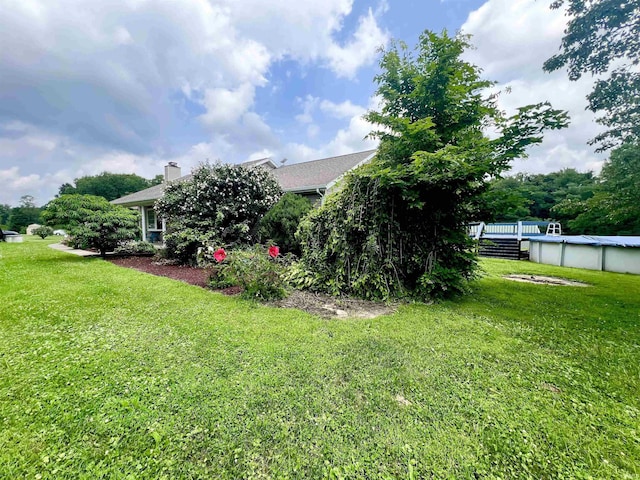 view of yard with an outdoor pool