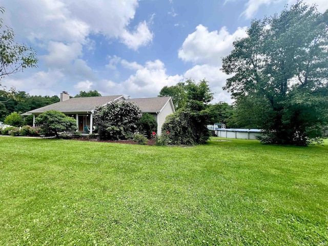 view of yard with an outdoor pool