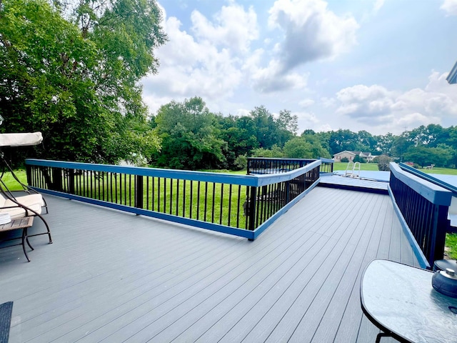 deck featuring a lawn