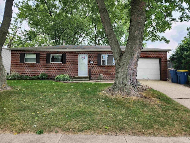 single story home featuring a garage and a front lawn