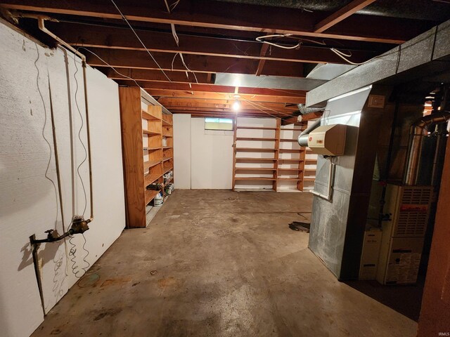 basement featuring heating unit