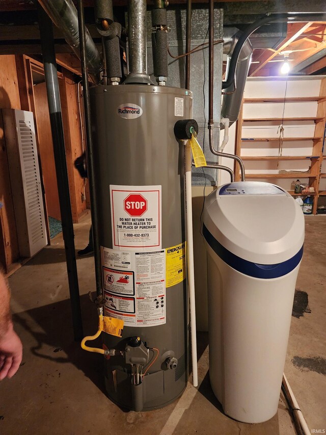 utility room with gas water heater