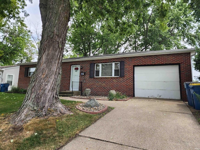 view of front of property with a garage and a front yard