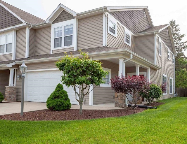 view of front facade featuring a front lawn and a garage