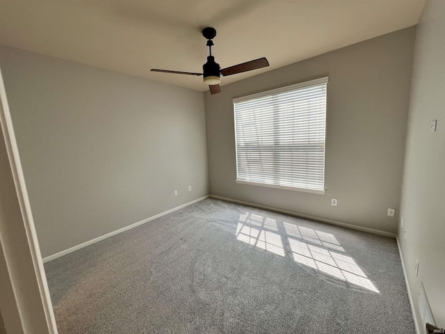 carpeted empty room with ceiling fan