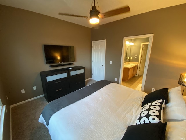 bedroom featuring ceiling fan, lofted ceiling, connected bathroom, and carpet