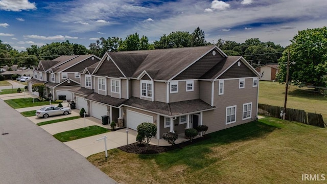 view of front of home with a garage and a front yard