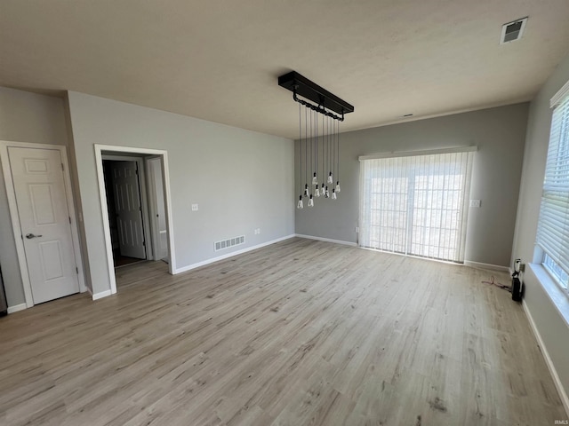 unfurnished dining area featuring light hardwood / wood-style floors