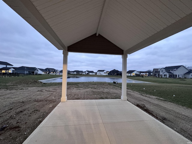 view of patio featuring a water view