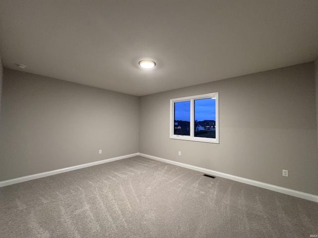 spare room featuring carpet flooring