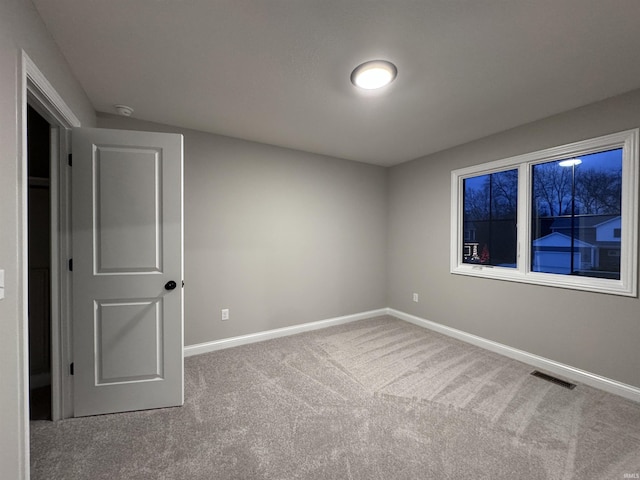 view of carpeted spare room