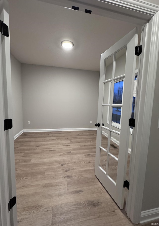 spare room featuring light hardwood / wood-style flooring