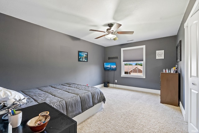 carpeted bedroom with ceiling fan