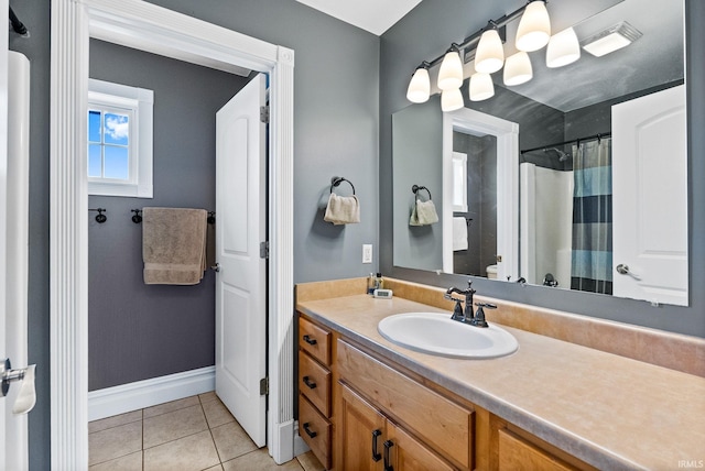 bathroom with vanity and tile patterned flooring