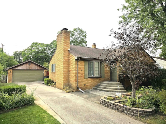 view of front of property with a garage and an outdoor structure