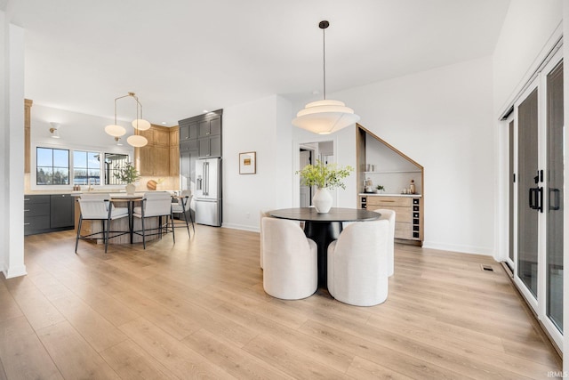 dining room featuring light hardwood / wood-style flooring