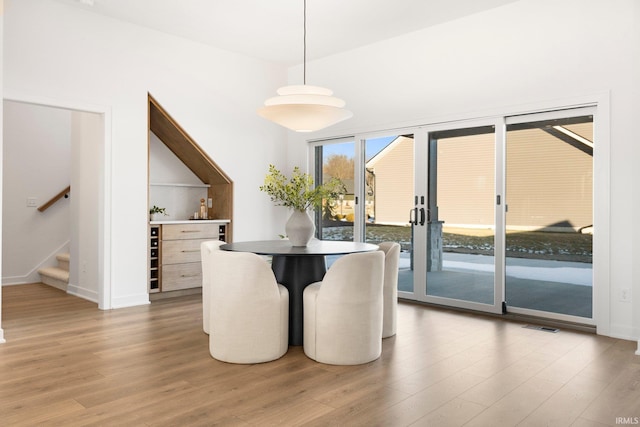 dining room with wood-type flooring