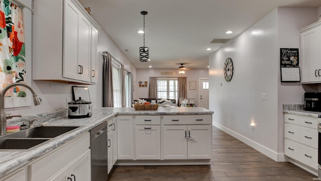 kitchen with dishwasher, dark wood-type flooring, sink, white cabinetry, and kitchen peninsula