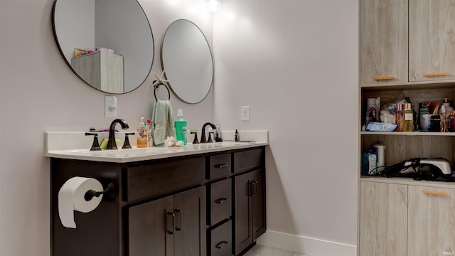 bathroom with vanity and tile patterned floors