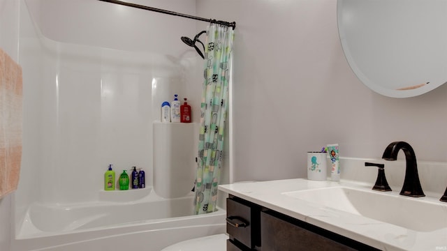 full bathroom with vanity, shower / bath combo with shower curtain, and toilet