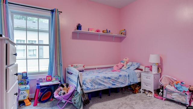 bedroom with multiple windows and carpet flooring