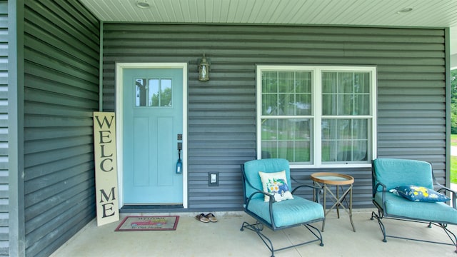 property entrance featuring a porch