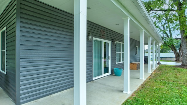 view of side of home featuring a porch