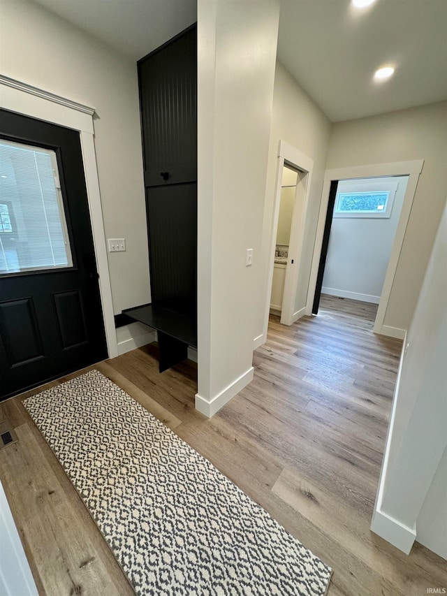 foyer with light hardwood / wood-style floors