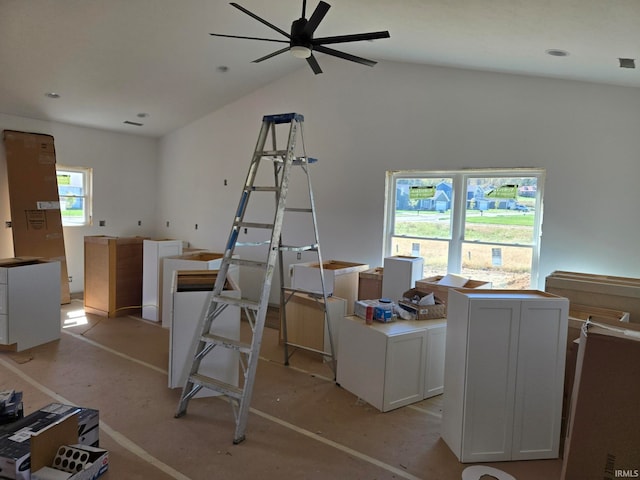 miscellaneous room featuring ceiling fan, lofted ceiling, and a wealth of natural light