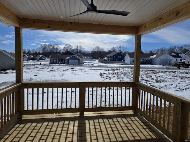 snow covered deck featuring ceiling fan