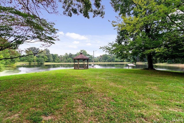 view of yard featuring a water view and a gazebo