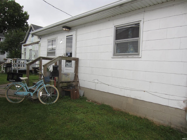 view of side of property with a lawn