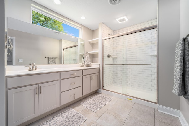 bathroom with vanity, tile patterned floors, and walk in shower