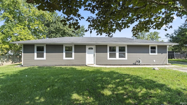 ranch-style home featuring a front yard