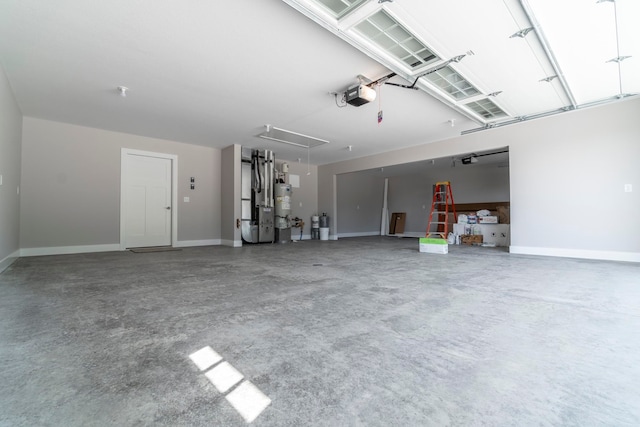 garage featuring strapped water heater, a garage door opener, and heating unit