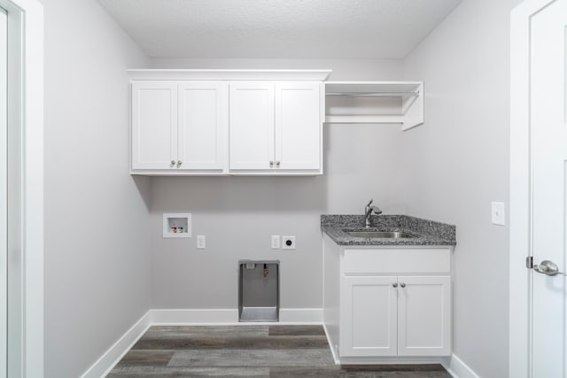 laundry room featuring sink, cabinets, dark hardwood / wood-style floors, electric dryer hookup, and washer hookup