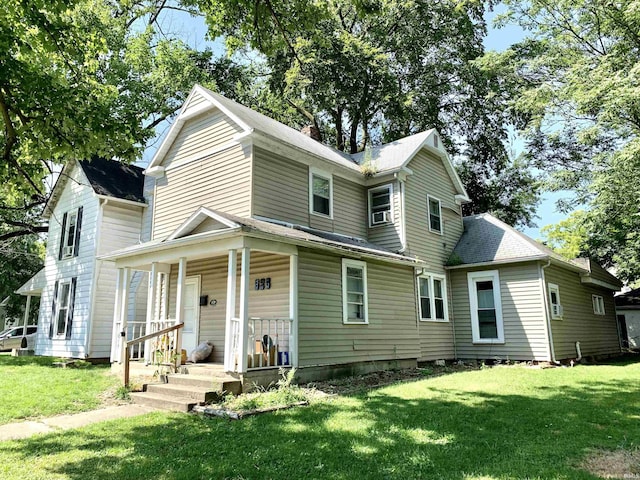 view of front property with a porch and a front yard