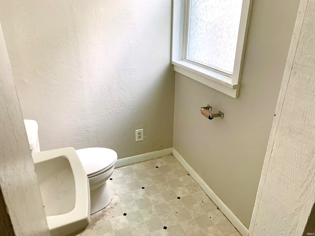 bathroom featuring toilet