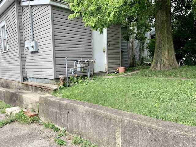 view of outbuilding featuring a yard