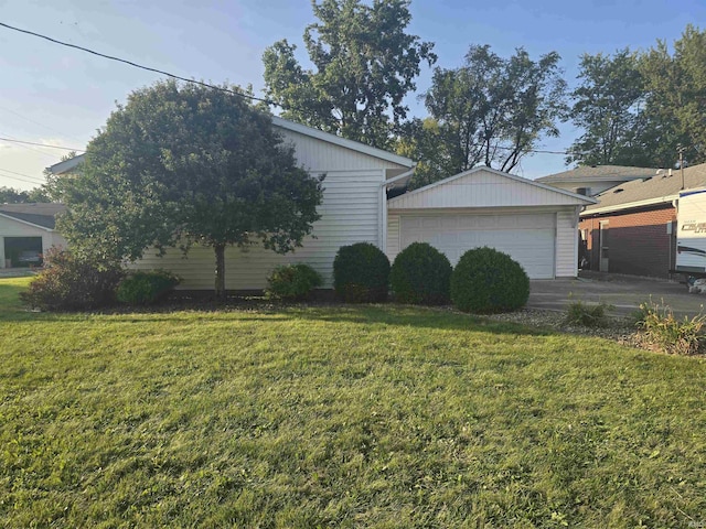 view of side of home with a garage and a yard