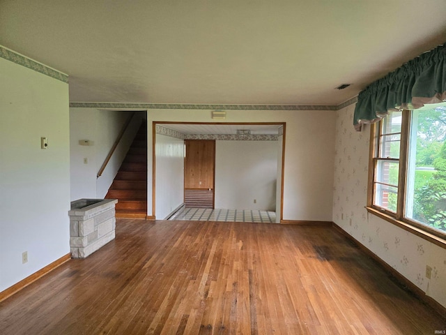 unfurnished living room with wood-type flooring