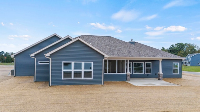 rear view of property with a patio area