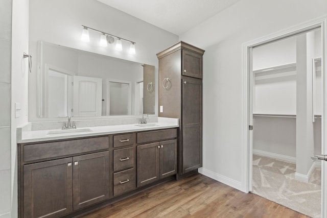 bathroom featuring vanity and hardwood / wood-style floors