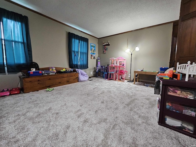 playroom featuring ornamental molding, a textured ceiling, and carpet