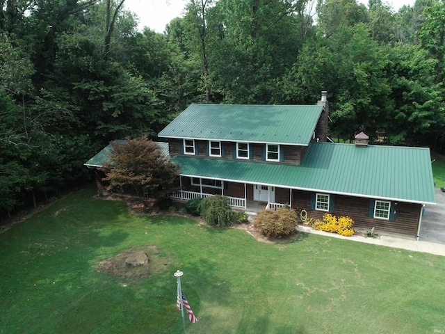 view of front of house with covered porch and a front yard