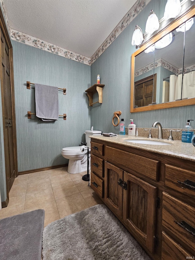 bathroom featuring toilet, a textured ceiling, vanity, a shower with shower curtain, and tile patterned flooring