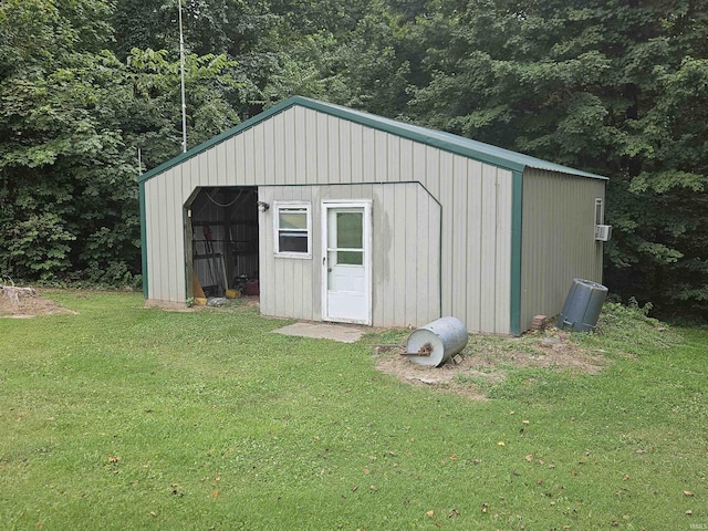 view of outdoor structure with a lawn