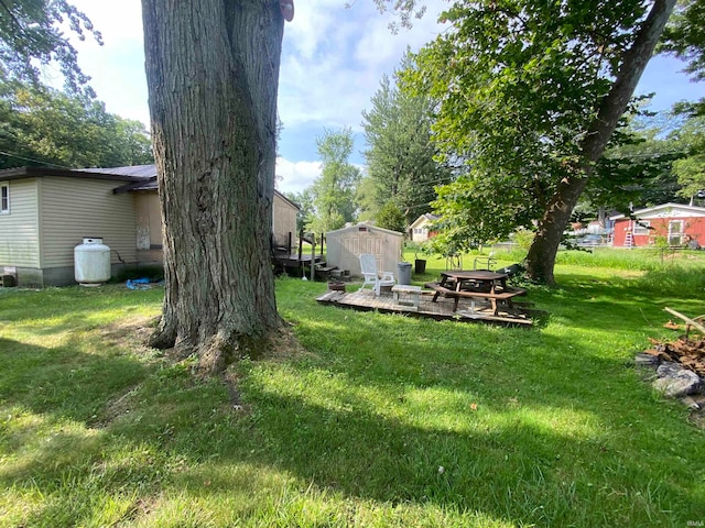 view of yard with a wooden deck