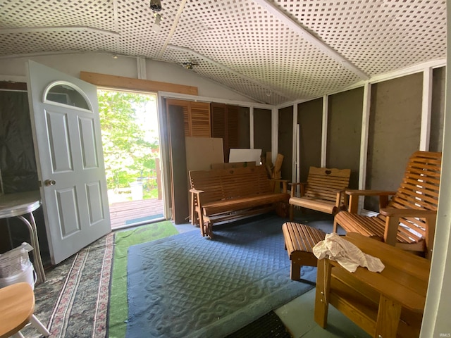 living area featuring vaulted ceiling